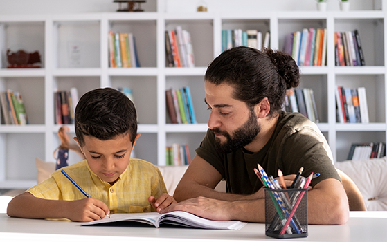 A teacher helping a student with their homework.