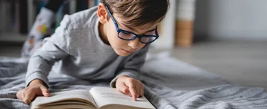 a child with dyslexia reading a book