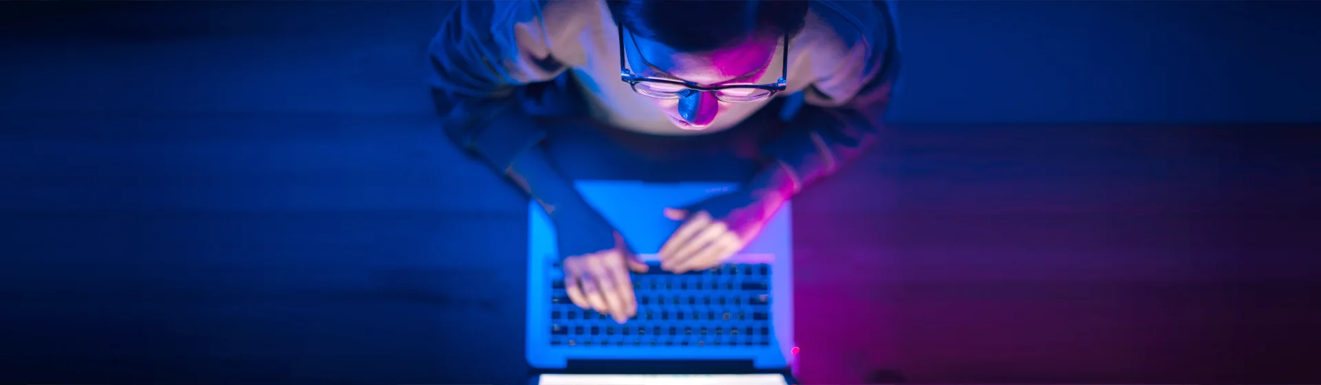 A woman tries to solve a technical issue with her laptop