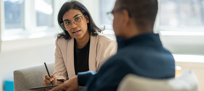 Psychologist speaking to a patient