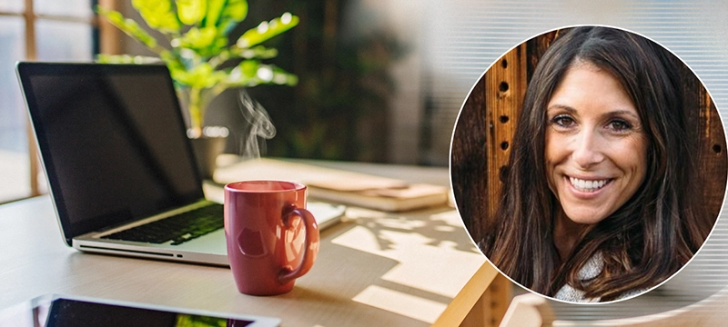 A school psychologist's office with a laptop and mug with an overlay image of Dr. Jamie Edwards smiling, representing how Dr. Edwards used AI Report Writer in her practice